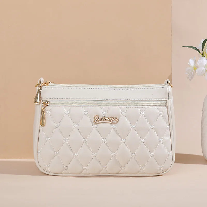 Embroidered Leather Handbag with Pom-Pom Charm