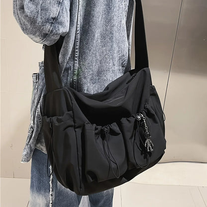 Large Crossbody Bag with Drawstring Accent & Charm – Spacious Zipper Shoulder Bag