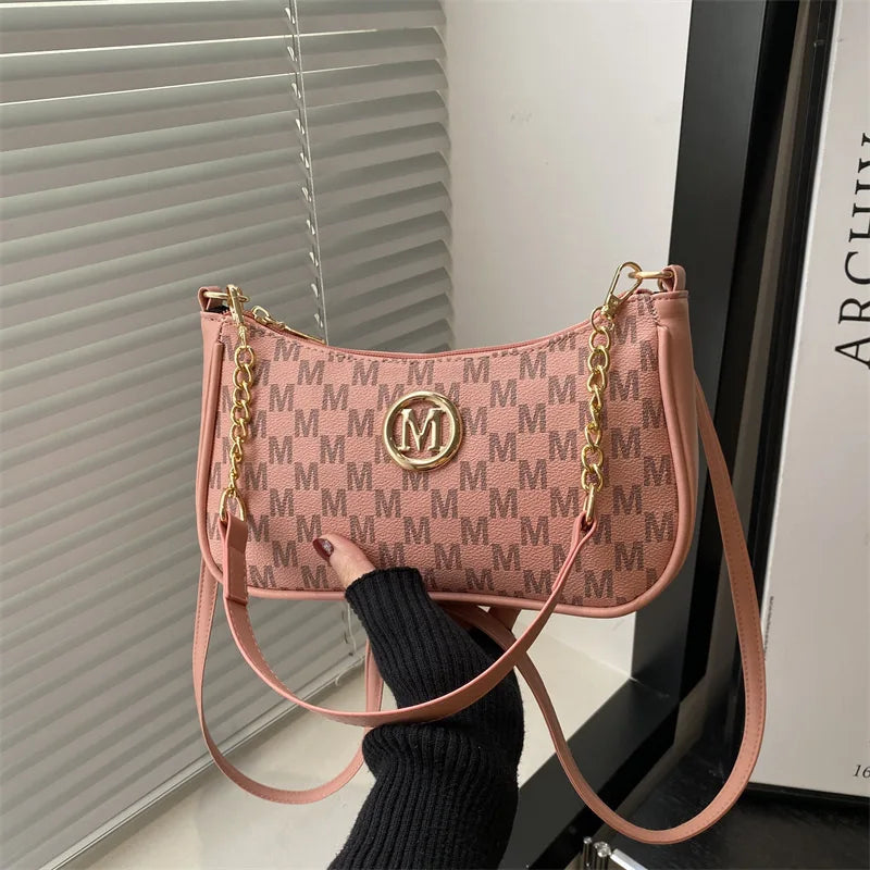 Classic Pattern Shoulder Bags Round Gold Emblem Adjustable Strap Elegant Design Daily Commutes