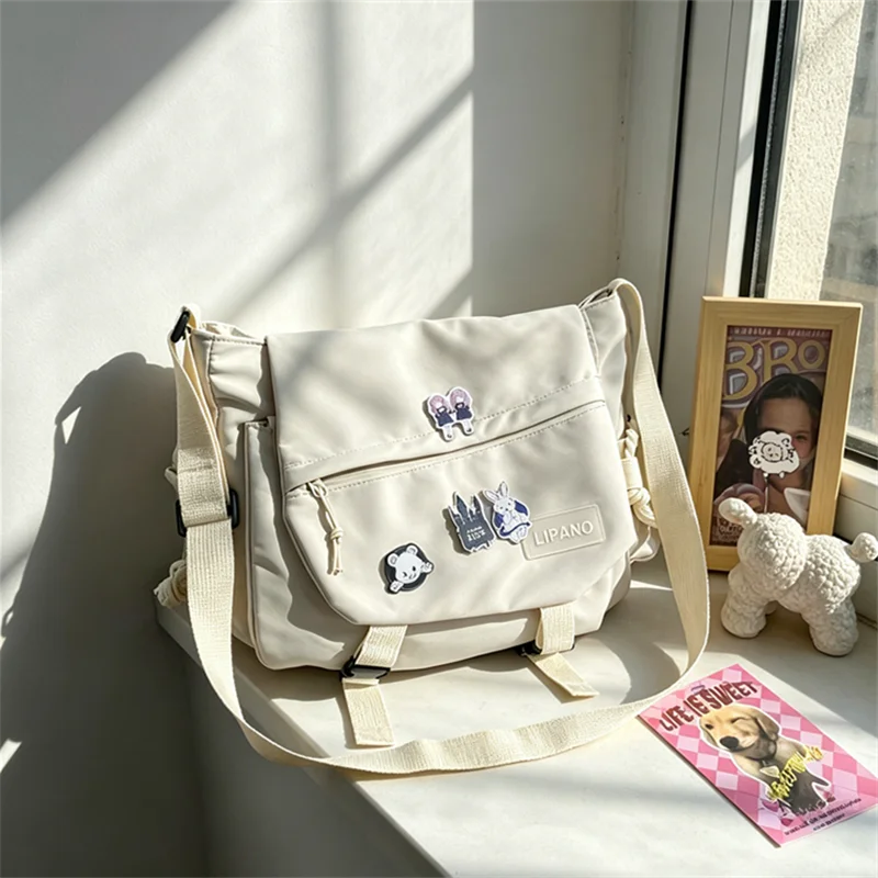 Multi-Pocket Nylon Crossbody Bag – Casual Messenger Bag with Badge for Teen, School & Travel