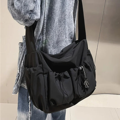 Large Crossbody Bag with Drawstring Accent & Charm – Spacious Zipper Shoulder Bag